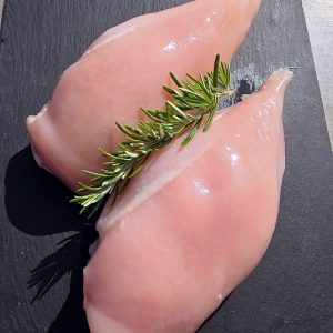 2 chicken breast fillets on a slate platter