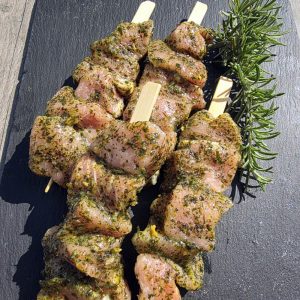 4 wild garlic pork kebabs on a slate platter