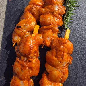 4 Teriyaki kebabs on a slate platter